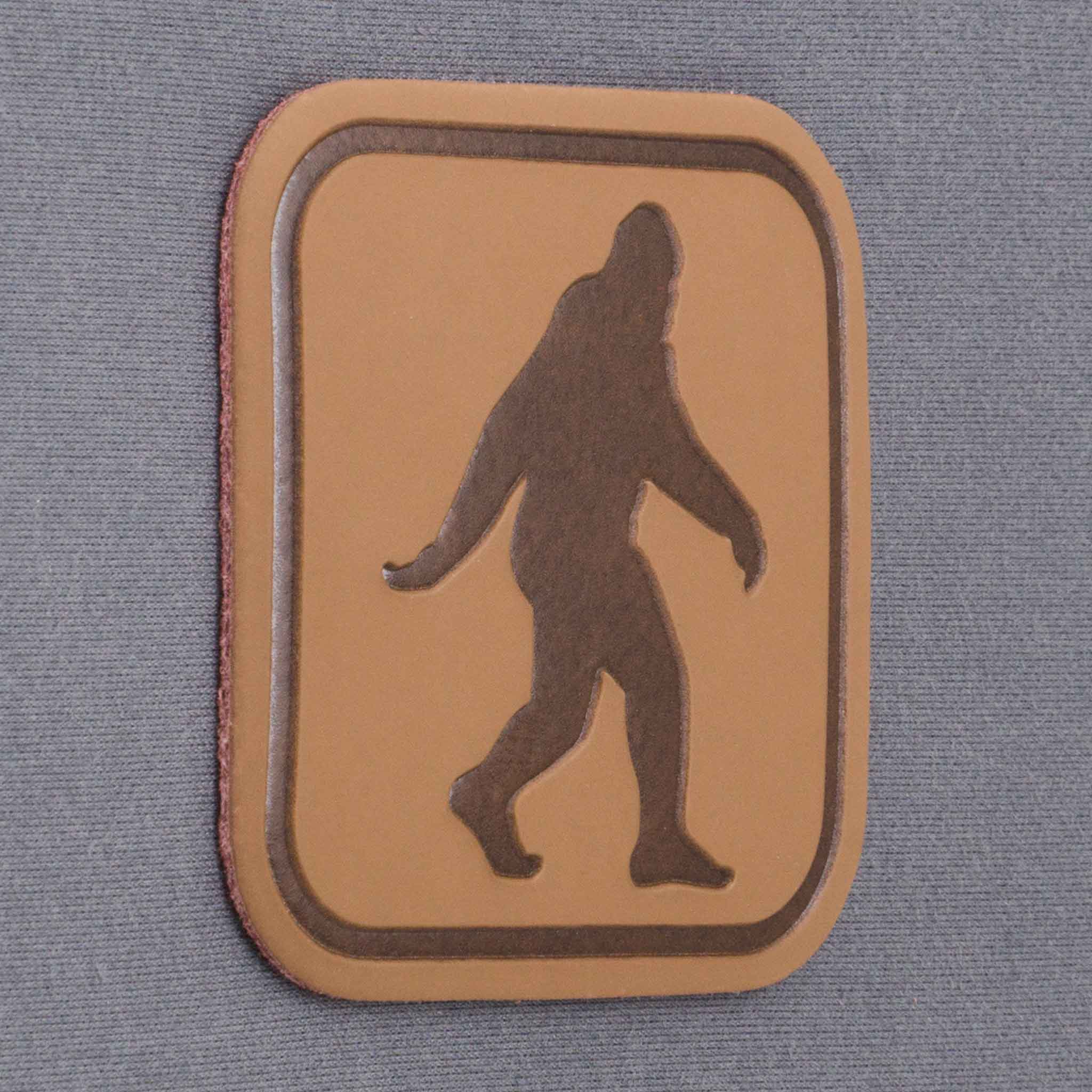 Bigfoot Trail Sign (Leather) - Flexfit® Mesh Trucker Cap Color: Coyote/Black - Eternal Glyph LLC