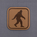 Bigfoot Trail Sign (Leather) - Flexfit® Mesh Trucker Cap Color: Coyote/Black - Eternal Glyph LLC