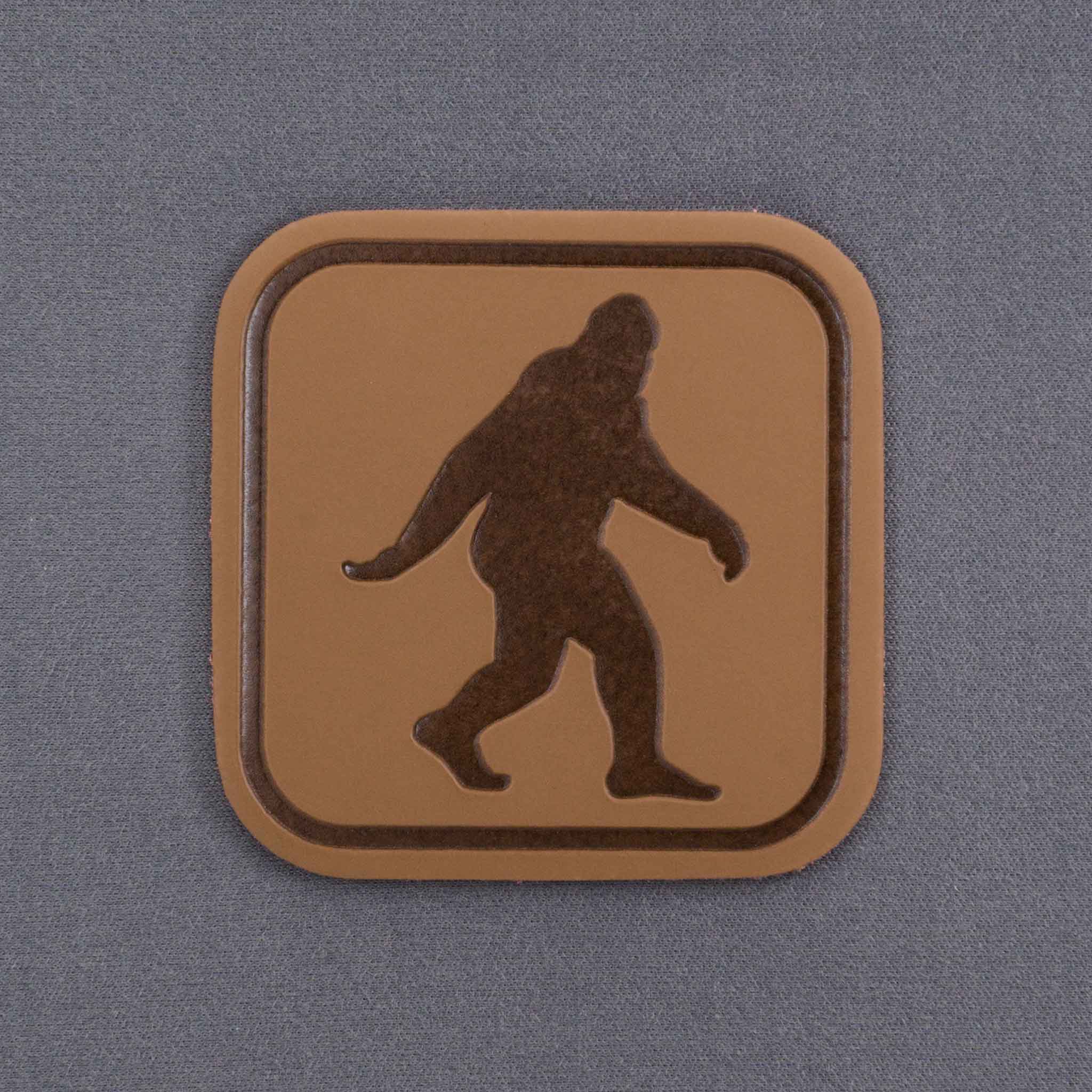 Bigfoot Trail Sign (Leather) - Flexfit® Mesh Trucker Cap Color: Coyote/Black - Eternal Glyph LLC