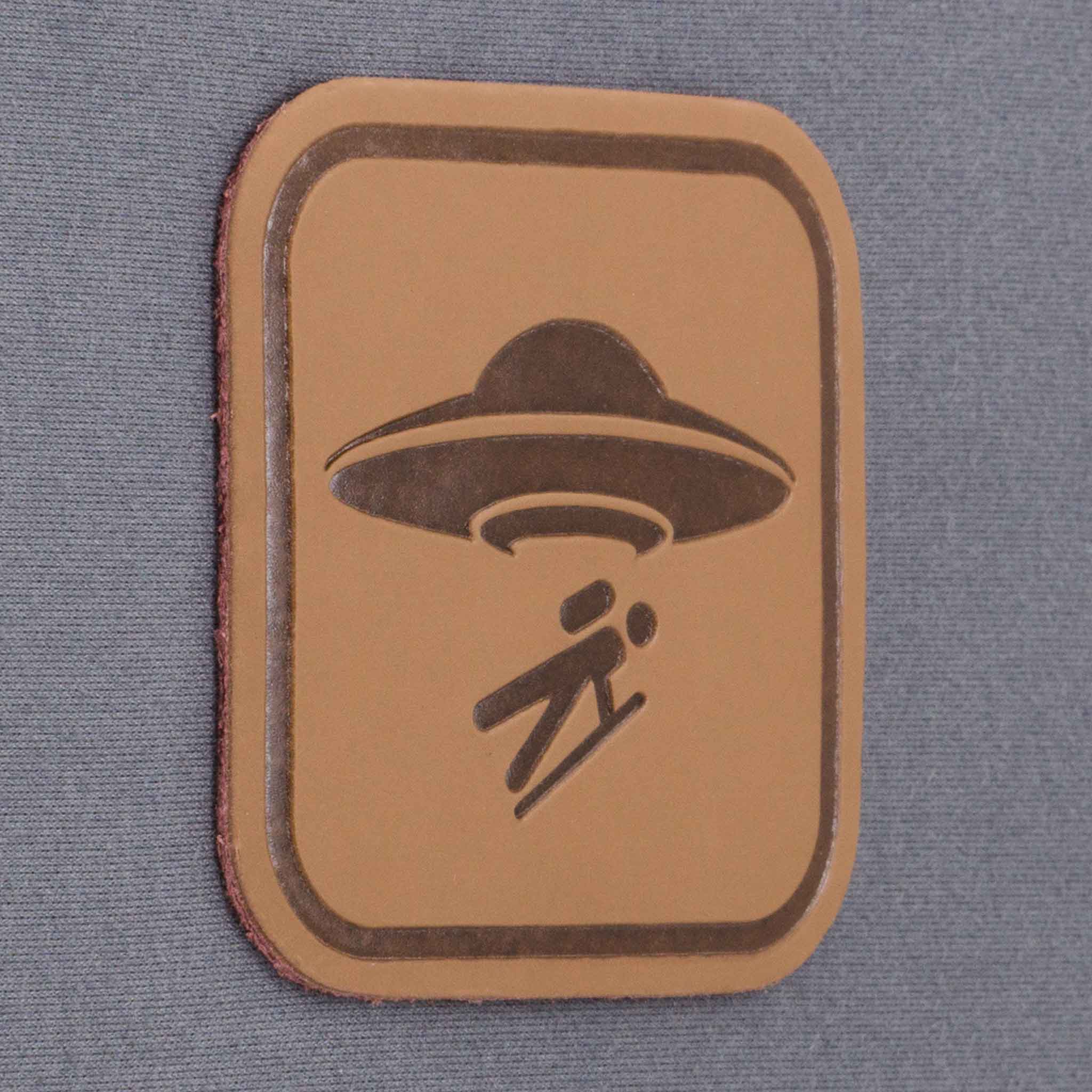 UFO Area Trail Sign (Leather) - Flexfit® Mesh Trucker Cap Color: Coyote/Black - Eternal Glyph LLC