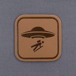 UFO Area Trail Sign (Leather) - Flexfit® Mesh Trucker Cap Color: Coyote/Black - Eternal Glyph LLC