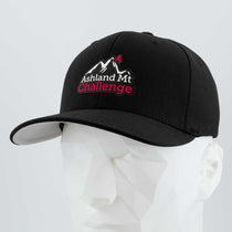 The Eternal Glyph Ashland Mt. Challenge (Double Layer Silicone) Flexfit® Premium Wool Blend Cap features white and red embroidery with a mountain graphic—ideal for fans of this iconic Pacific Northwest race. Shown on a white faceted mannequin head.