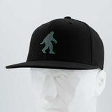 Bigfoot Silhouette (Silicone) - Flexfit® Premium Fitted Cap Color: Black - Eternal Glyph LLC