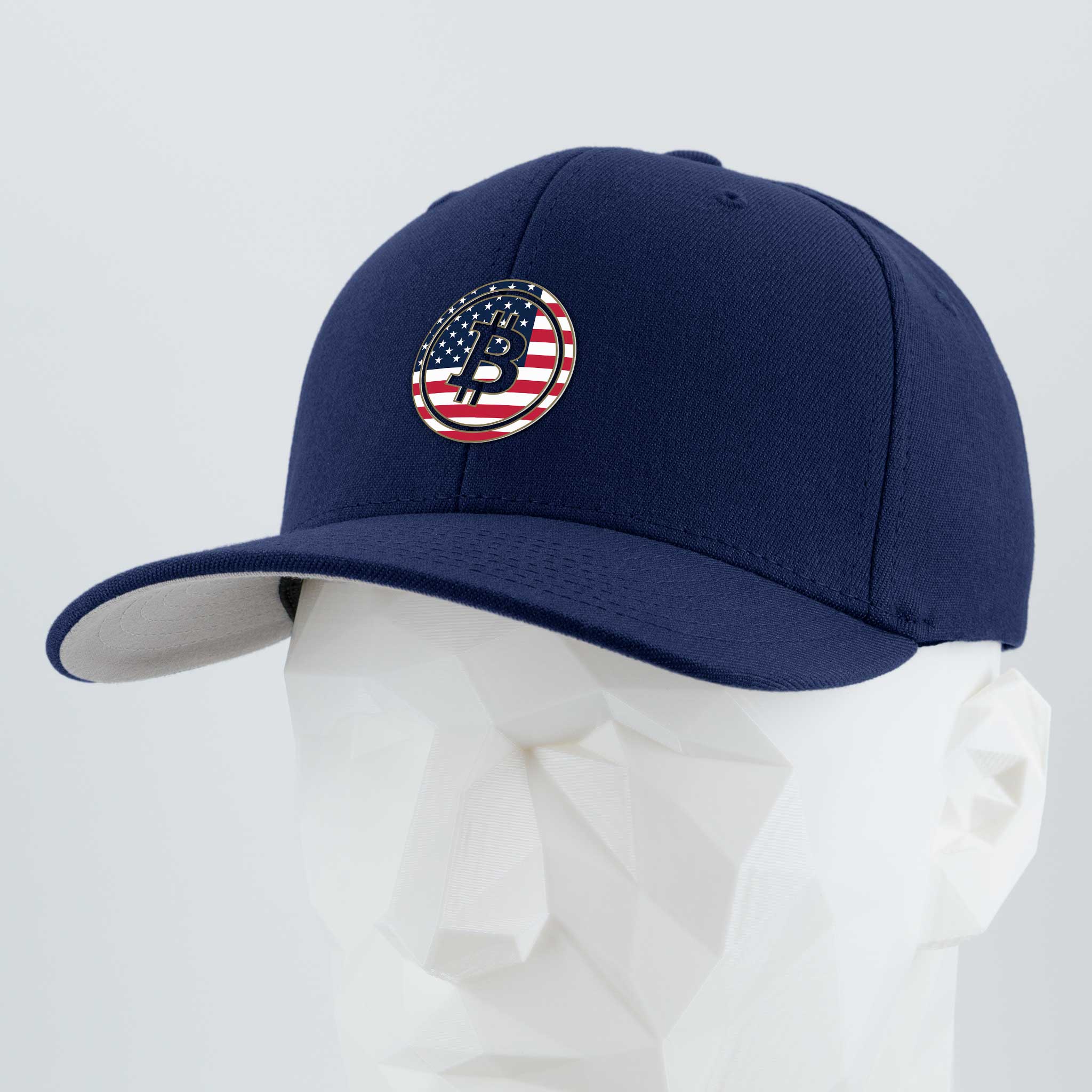 The Eternal Glyph Bitcoin U.S.A. (Silicone) Flexfit® Premium Wool Blend Cap features a blue design with a circular Bitcoin USA patch over an American flag, shown on a white geometric mannequin—perfect for expressing digital currency pride.