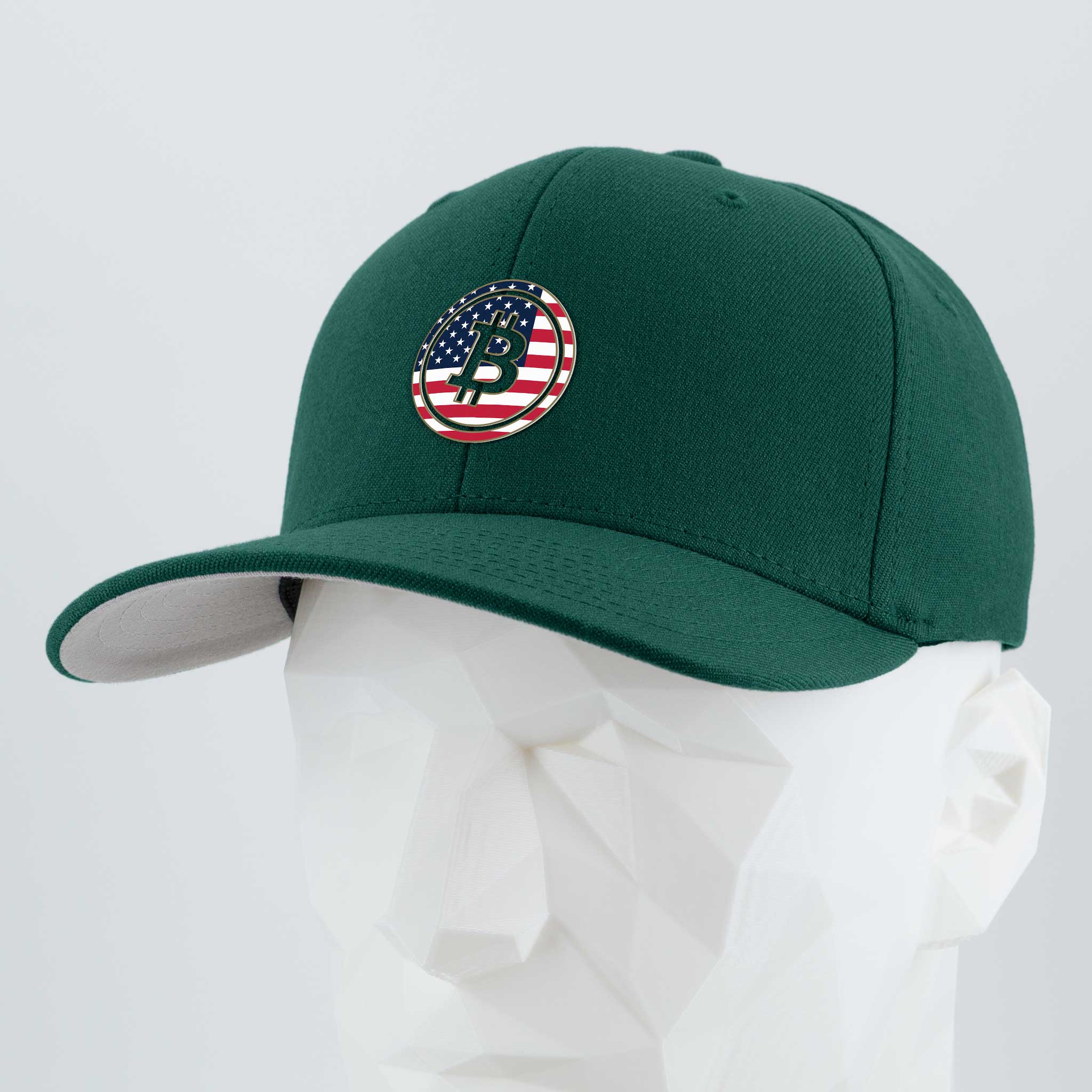 The Eternal Glyph Bitcoin U.S.A. (Silicone) Flexfit® Premium Wool Blend Cap in dark green features a circular American flag logo with a black Bitcoin USA glyph, shown on a white geometric mannequin head.