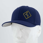 The Eternal Glyph Deer Crossing Sign (Silicone) - Flexfit® Premium Wool Blend Cap features a navy blue design with a yellow outlined deer in a diamond shape on the front, shown on a white geometric mannequin head.