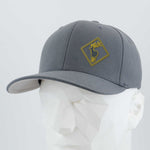 The Eternal Glyph Elk Crossing Sign (Silicone) Flexfit® Premium Wool Blend Cap features a gray design with a yellow-outlined elk patch, shown on a white mannequin—ideal for fans of nature-themed accessories.