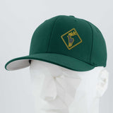 The Eternal Glyph Elk Crossing Sign (Silicone) Flexfit® Premium Wool Blend Cap features a yellow deer head silicone patch on green, channeling elk symbolism—ideal for fans of nature-inspired accessories. Displayed on a white geometric mannequin.