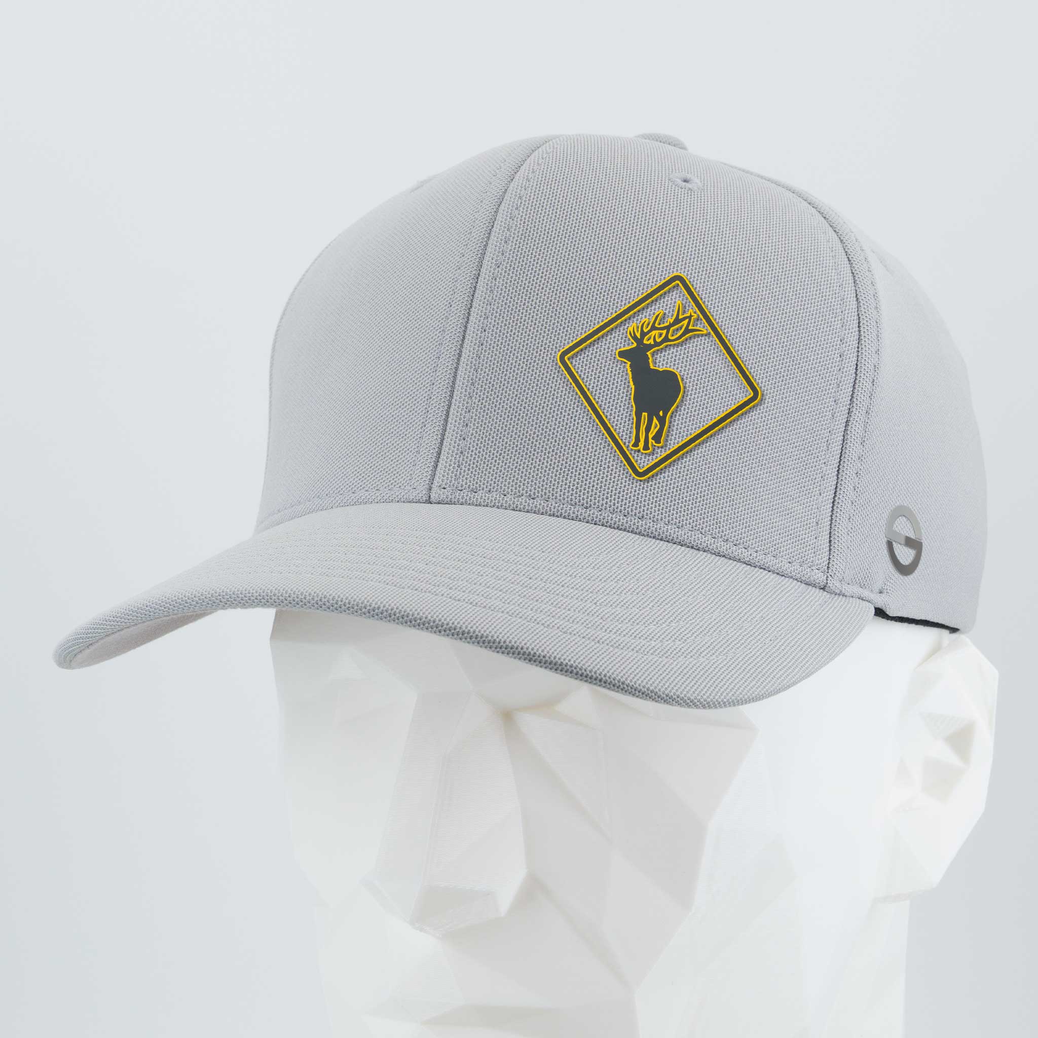 The Eternal Glyph Elk Crossing Sign (Silicone) - Flexfit® Cool & Dry Cap, shown on a faceted white mannequin head, features a yellow and black elk sign patch on the front and a small circular side logo.