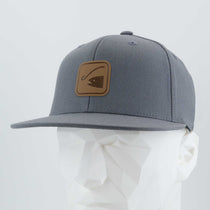 The Eternal Glyph Fishing Trail Sign (Leather) Flexfit® Flat Bill Premium Fitted Cap features a gray design with a brown leather patch of a fish hook, shown on a white mannequin. Ideal for fishing fans and outdoor adventurers.