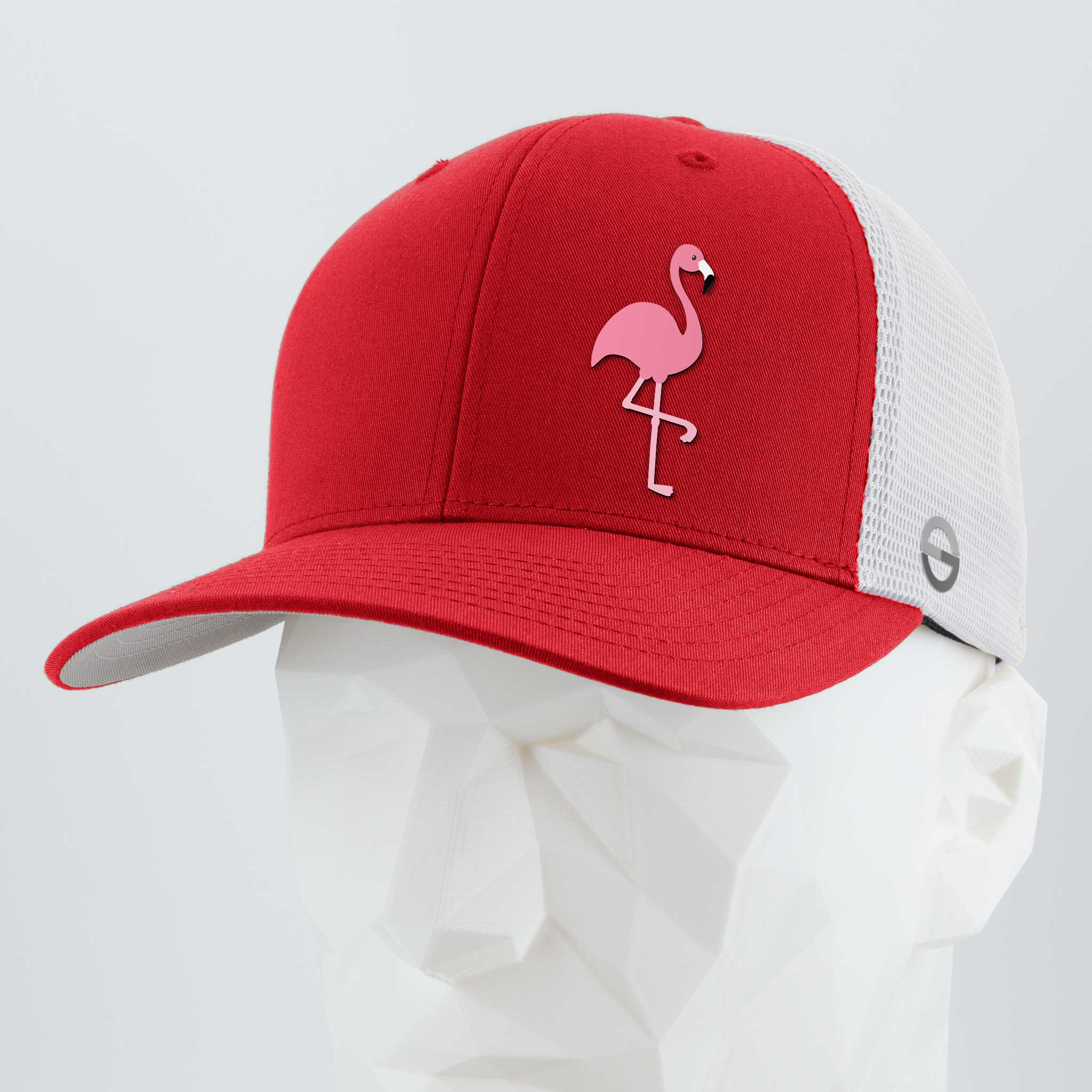 The Eternal Glyph Pink Flamingo (Silicone) Flexfit® Mesh Trucker Cap in Red/White adds summer flair with its pink flamingo glyph. It features a red bill and front panels, white mesh sides/back, and is shown on a white geometric mannequin head.
