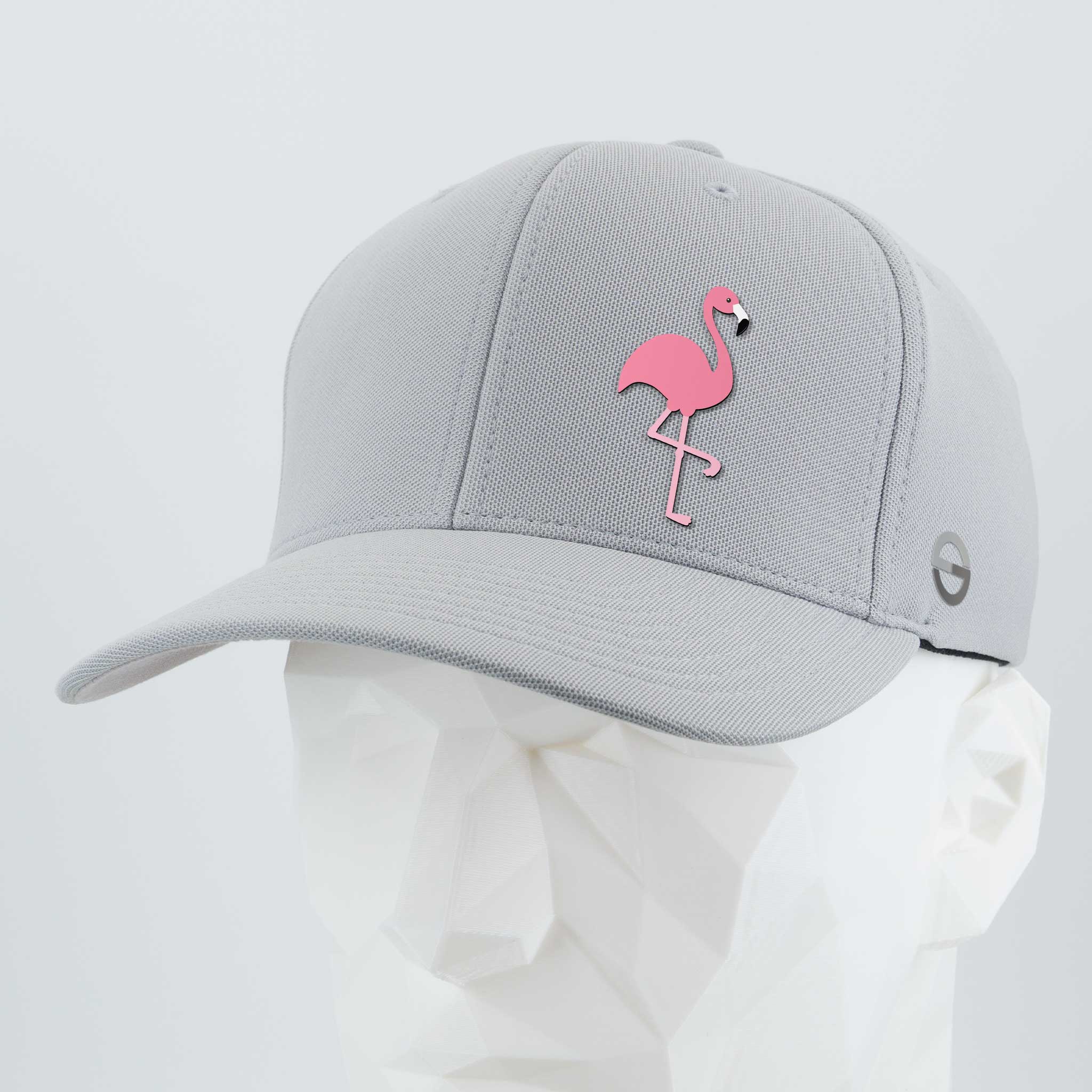 The Eternal Glyph Pink Flamingo - Flexfit® Cool & Dry Cap features a light gray design with a pink flamingo glyph embroidered on the front, channeling retro summer vibes—shown here on a white faceted mannequin head.