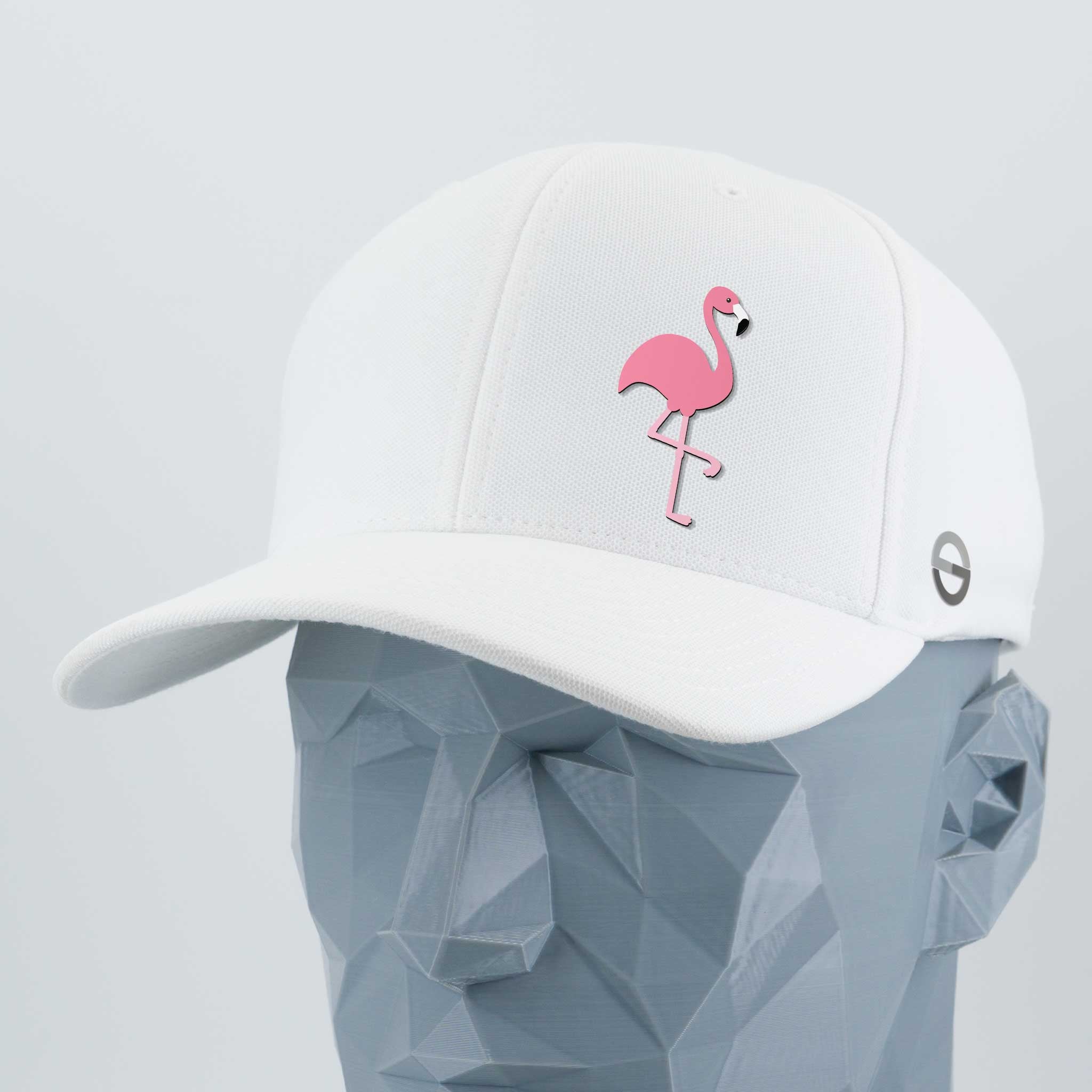 The Eternal Glyph Pink Flamingo - Flexfit® Cool & Dry Cap in white features a Pink Flamingo glyph on the front and a small circular logo on the side, channeling retro lawn flamingos and summer vibes.