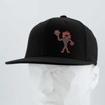 The Eternal Glyph Friendly Man Petroglyph (Silicone) Flexfit® Flat Bill Premium Fitted Cap in black features an outlined abstract figure with spiky hair, inspired by the Moab, Utah petroglyph, displayed on a white mannequin head.
