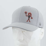 The Eternal Glyph Friendly Man Petroglyph (Silicone) Flexfit® Cool & Dry Cap in Silver features a red outlined Kokopelli, inspired by Moab Utah's petroglyph, embroidered on the front and a small circular side logo. Displayed on a geometric mannequin head.