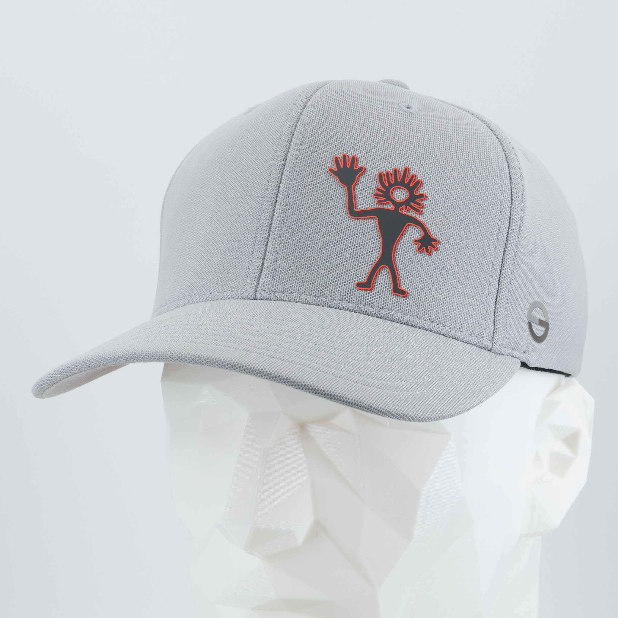 The Eternal Glyph Friendly Man Petroglyph (Silicone) Flexfit® Cool & Dry Cap in Silver features a red outlined Kokopelli, inspired by Moab Utah's petroglyph, embroidered on the front and a small circular side logo. Displayed on a geometric mannequin head.