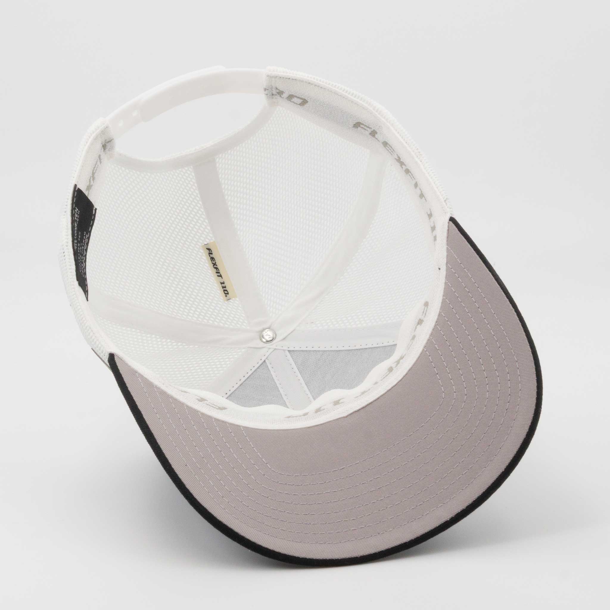 The Eternal Glyph Campfire Trail Sign (Silicone) Flexfit® Mesh Trucker Cap is shown upside down, displaying its white mesh interior, flexible band, and light gray stitched bill—ideal for exploring campfire trails or spotting a trail sign.