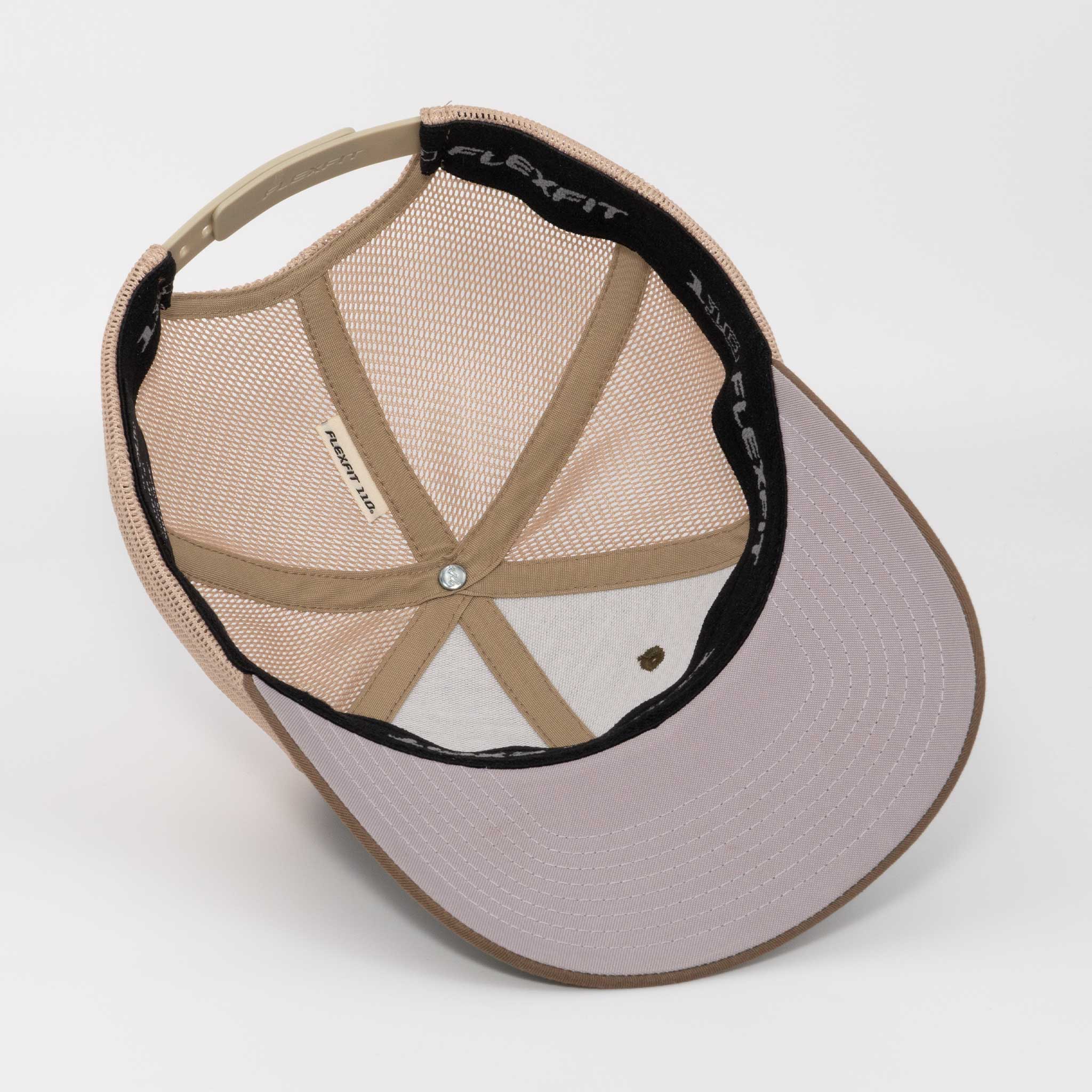 The Eternal Glyph Campfire Trail Sign (Silicone) Flexfit® Mesh Trucker Cap features a beige design, mesh panels, plastic adjustable strap, gray curved brim with white stitching, and a black inner sweatband with campfire trail sign motif.