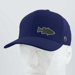 The Eternal Glyph Large Mouth Bass Fishing Flexfit® Cool & Dry Cap in navy blue features a silicone largemouth bass silhouette patch on the front, shown here on a white geometric mannequin head.