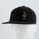 The Eternal Glyph Moab Shaman Petroglyph (Silicone) Flexfit® Flat Bill Premium Fitted Cap in black features a simple red line inspired by the iconic glyph, shown on a white geometric mannequin head against a light background.
