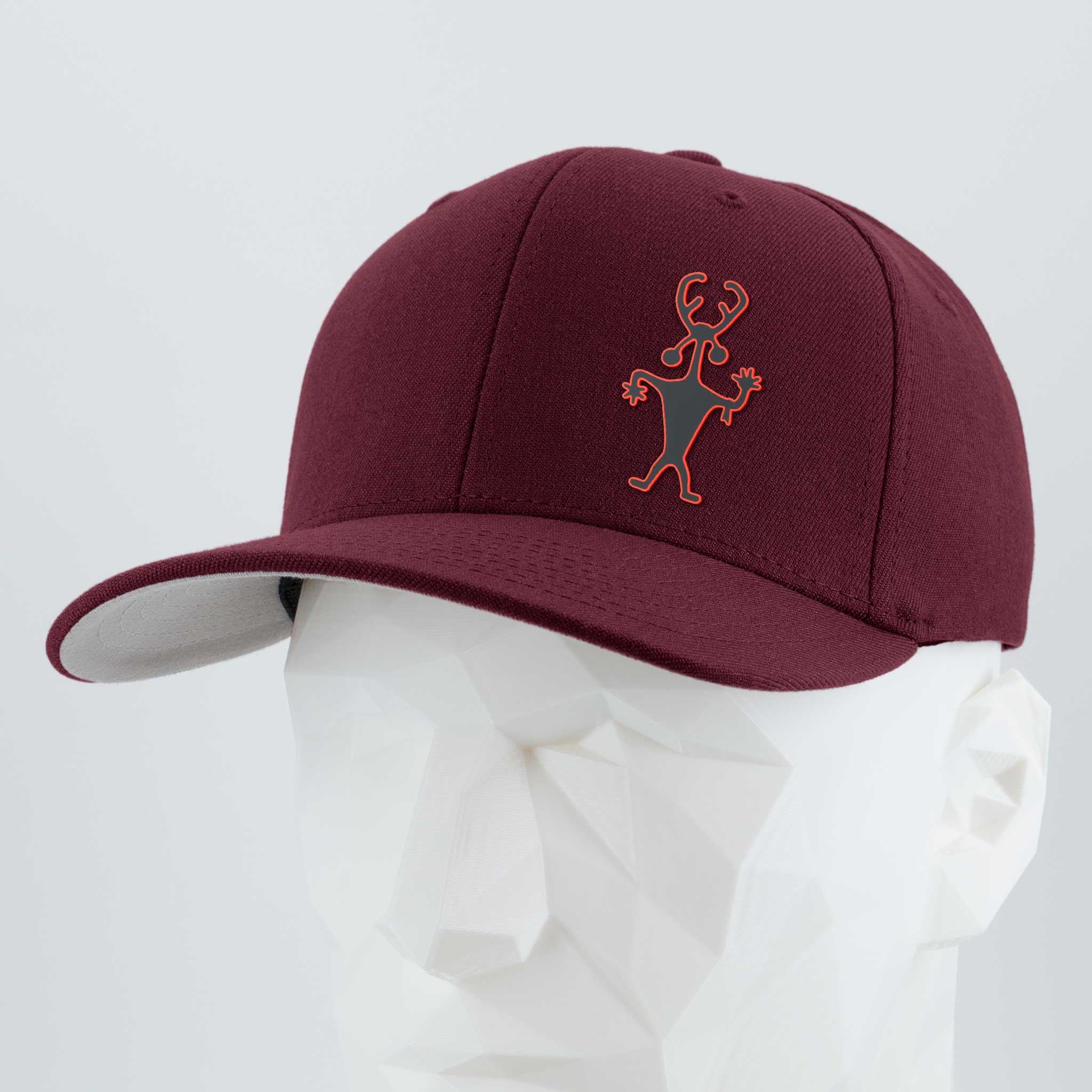 The Eternal Glyph Moab Man Petroglyph (Silicone) Flexfit® Premium Wool Blend Cap features a maroon color with an orange stick-figure lizard logo, shown on a white geometric mannequin against a plain light background.