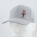 The Eternal Glyph Moab Man Petroglyph (Silicone) Flexfit® Cool & Dry Cap in Silver features a stylized red and black ancient stick figure design on the front and a small circular logo on the side, shown on a white geometric mannequin head.