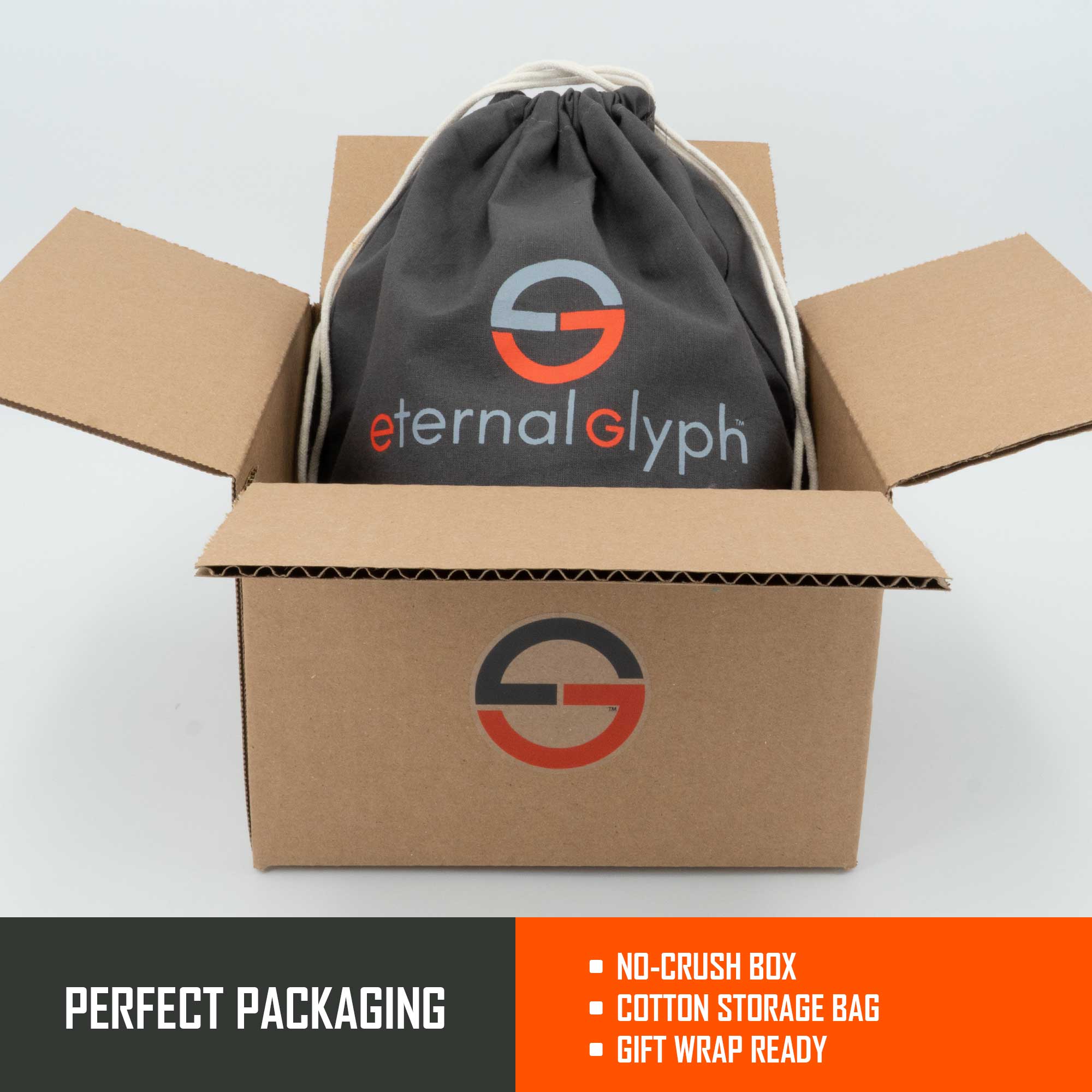 A brown box with the Eternal Glyph logo holds a gray drawstring cotton bag, both branded, protecting your Hiker Trail Sign (Silicone) - Flexfit® Mesh Trucker Cap—ready for gifting or the trail. “No-crush box, Cotton storage bag, Gift wrap ready.”.