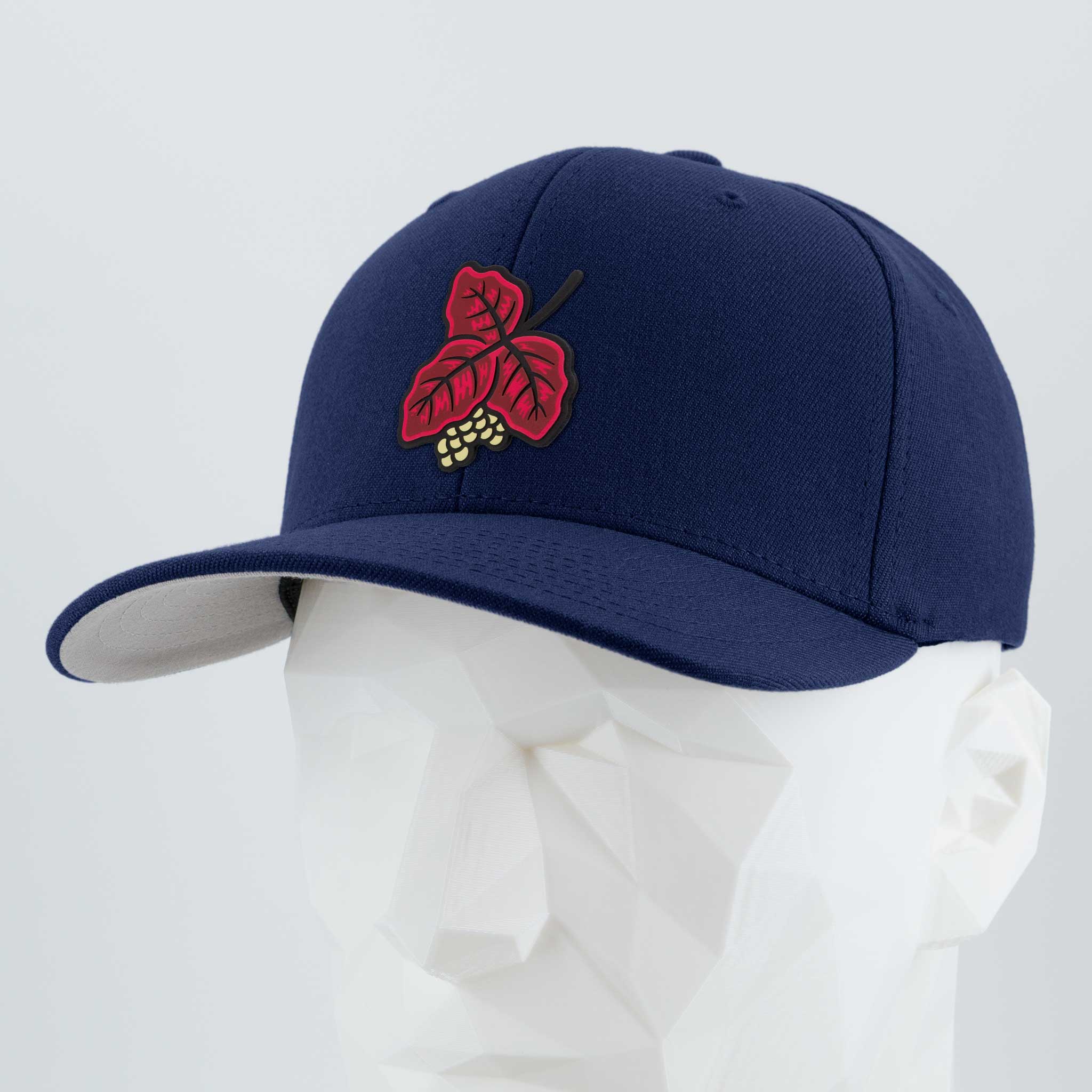 The Poison Oak (Double Layer Silicone) Flexfit® Premium Wool Blend Cap by Eternal Glyph features red leaf and yellow berry embroidery, shown on a white geometric mannequin head against a light gray background—ideal for outdoor enthusiasts.