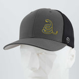 The Eternal Glyph Coiled Rattlesnake Silhouette (Silicone) Flexfit® Mesh Trucker Cap in gray and black features a yellow rattlesnake graphic inspired by the Gadsden flag, shown on a white geometric mannequin head.