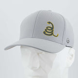The Eternal Glyph Coiled Rattlesnake Silhouette (Silicone) Flexfit® Cool & Dry Cap is light gray with a yellow rattlesnake graphic, Gadsden flag-inspired, plus a small circular logo on the side, shown on a white faceted mannequin head.