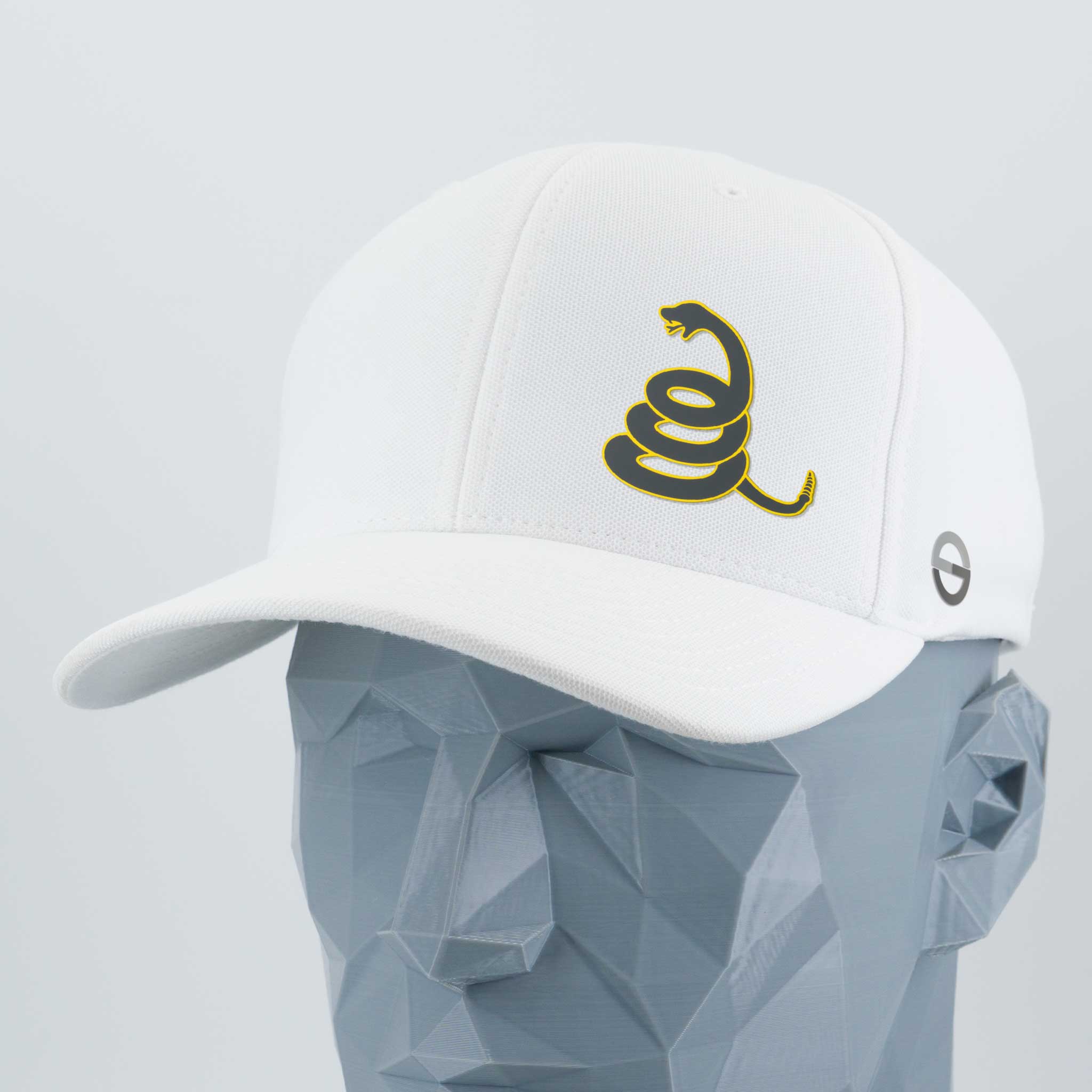 The Eternal Glyph Coiled Rattlesnake Silhouette (Silicone) Flexfit® Cool & Dry Cap is a white cap featuring a Gadsden flag-inspired rattlesnake graphic and side logo, displayed on a faceted mannequin for a bold symbol of strength.