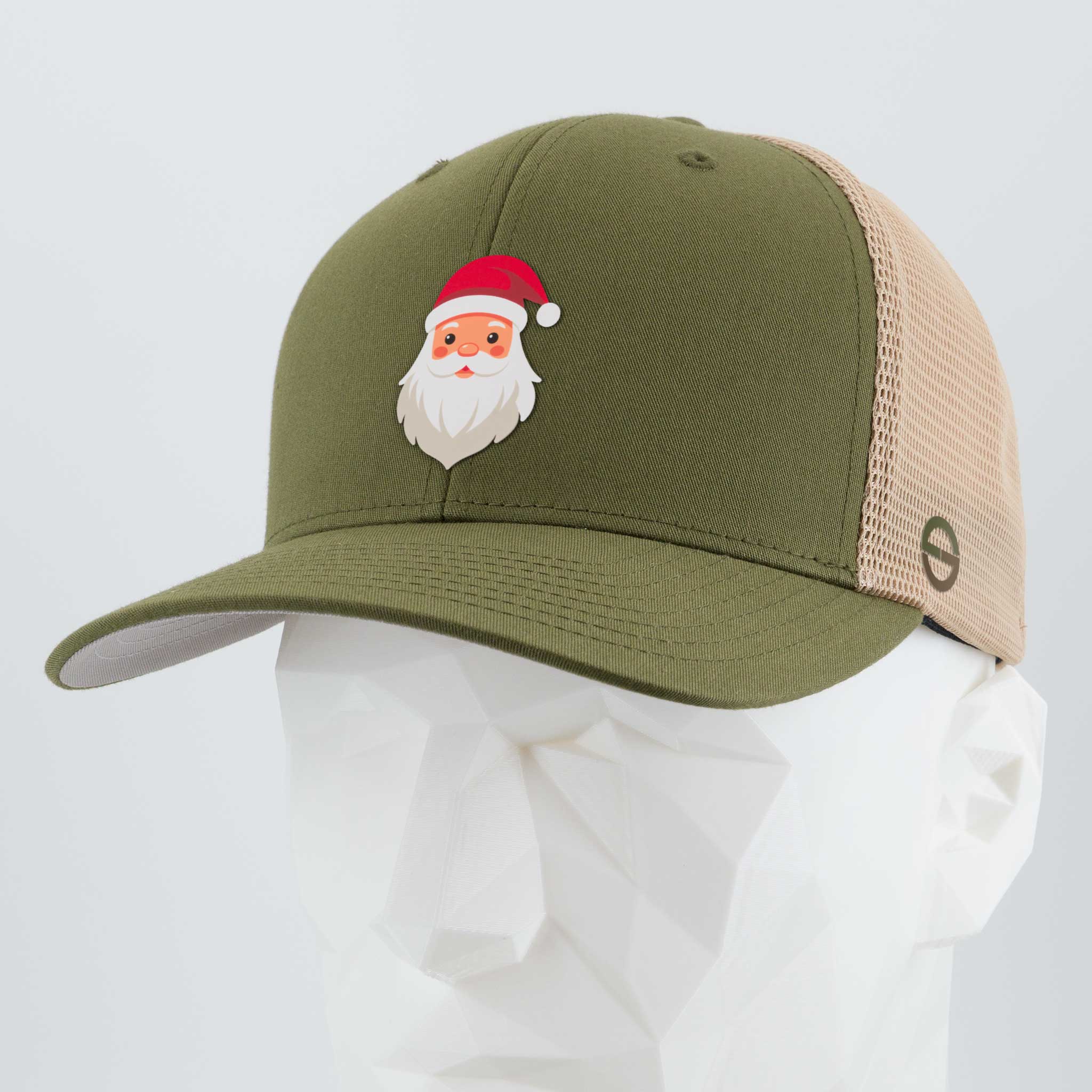 The Eternal Glyph Santa Hat (Silicone) Flexfit® Mesh Trucker Cap in olive/khaki features a cartoon Santa Claus glyph on the front—perfect for adding festive flair to any outfit. Displayed here on a faceted white mannequin head.