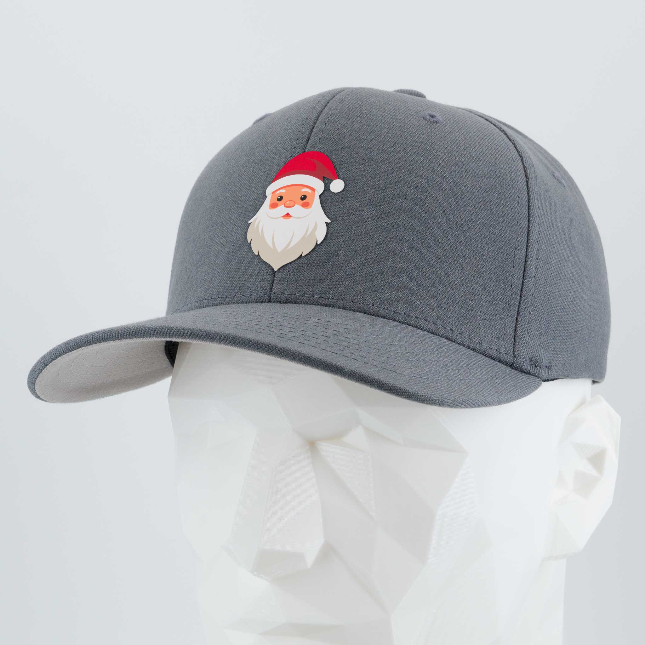 The Eternal Glyph Santa Hat (Silicone) - Flexfit® Premium Wool Blend Cap in dark gray features a subtle Santa Claus design, shown on a white faceted mannequin head against a plain background—ideal for understated holiday style.