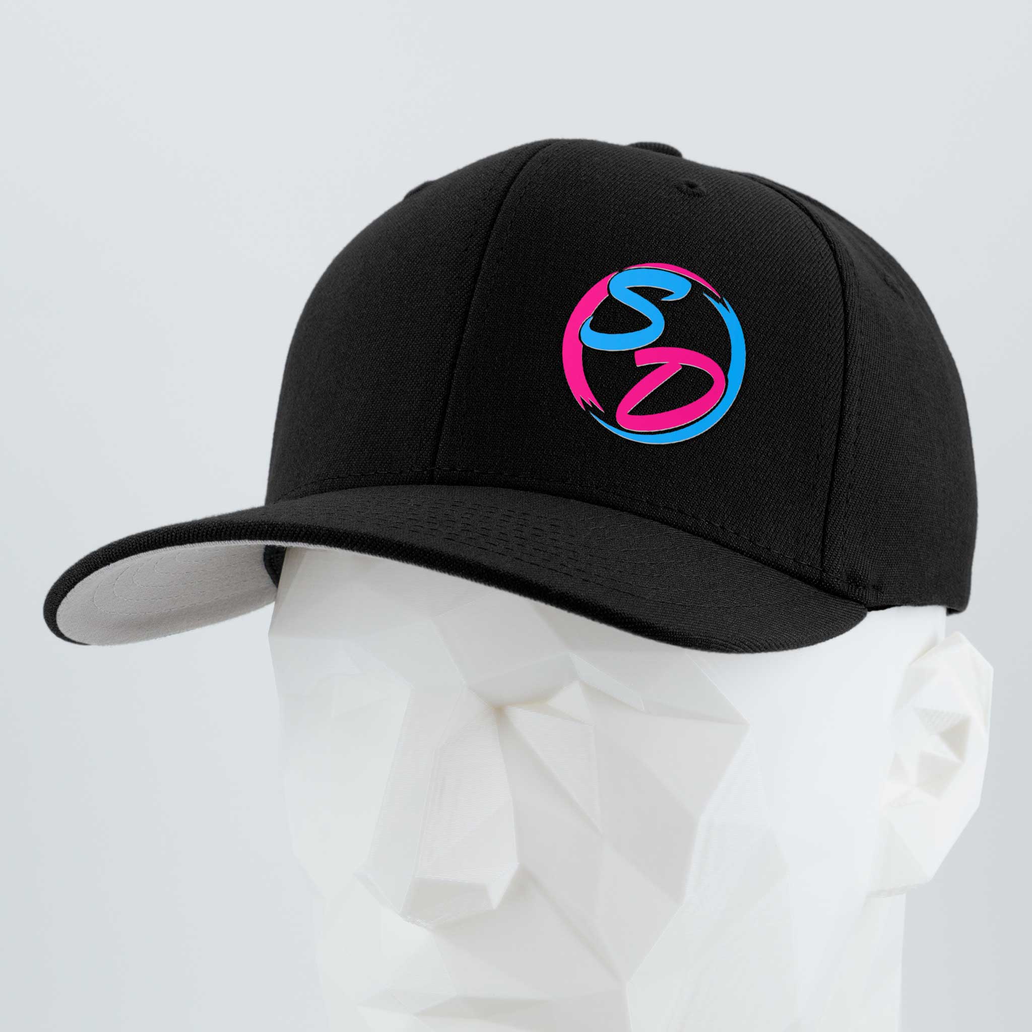 A black Eternal Glyph “Staying Driven (Silicone) - Flexfit® Premium Wool Blend Cap” featuring a blue and pink SD logo on the front is showcased on a white geometric mannequin head against a light gray background—perfect premium headwear for dedicated Staying Driven fitness enthusiasts.