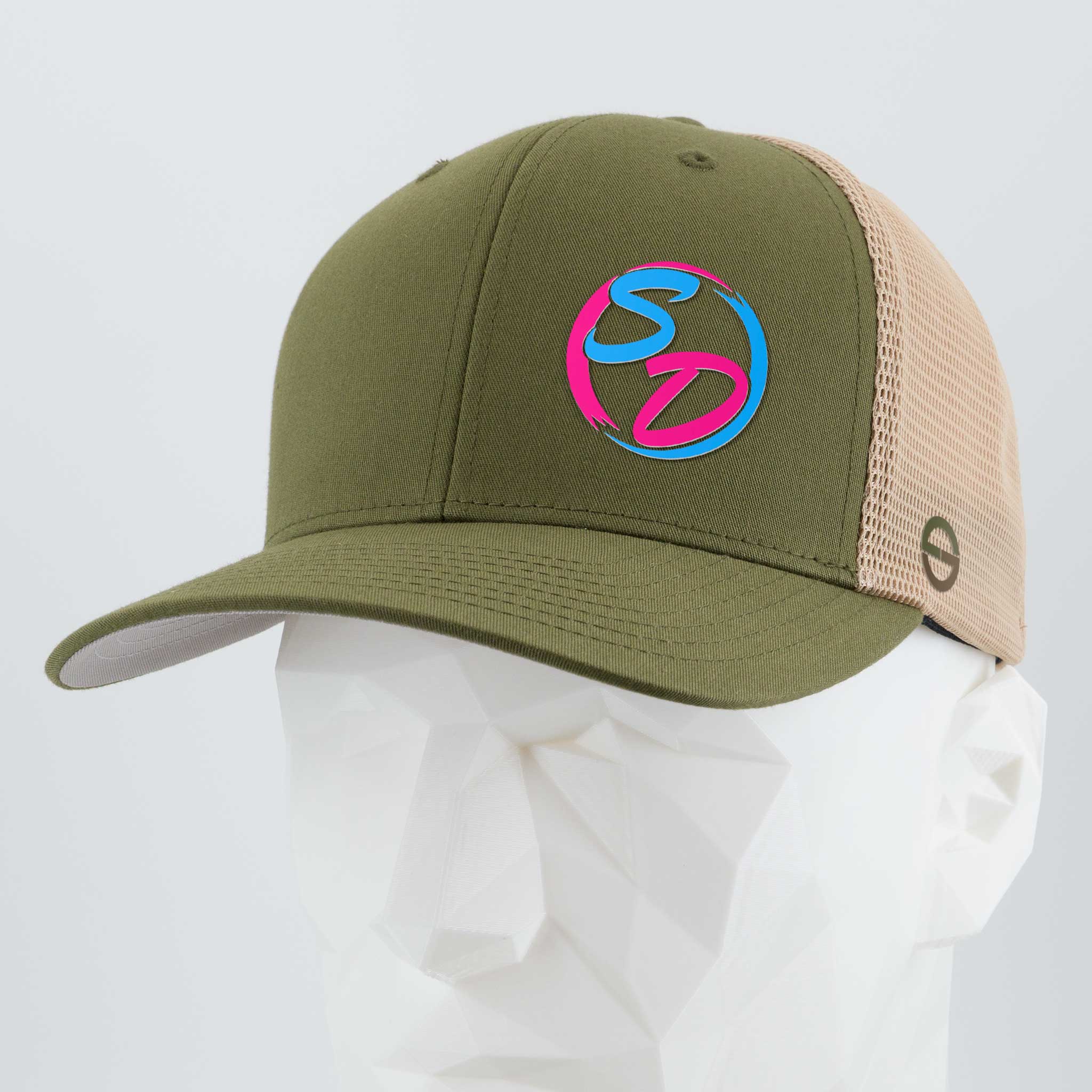 Showcased on a white faceted mannequin head against a light gray backdrop, the Eternal Glyph Staying Driven (Silicone) - Flexfit® Mesh Trucker Cap features an olive/khaki colorway and a vibrant SD logo on the front. This premium trucker hat is ideal for any online fitness crew aiming to stand out.