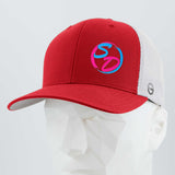 Certainly! Here’s the rewritten sentence incorporating your provided product data: The Eternal Glyph Staying Driven (Silicone) Flexfit® Mesh Trucker Cap, shown here in red and white, features a colorful SD logo on the front. This premium cap is displayed on a faceted white mannequin head against a light gray background.