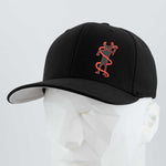 The Eternal Glyph Moab Shaman Petroglyph Flexfit® Premium Wool Blend Cap in black features an orange kokopelli outline inspired by ancient Utah art, shown on a white mannequin head against a light gray background.
