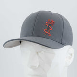 The Eternal Glyph Moab Shaman Petroglyph (Silicone) Flexfit® Premium Wool Blend Cap in dark gray features an orange stylized Moab Shaman design on the front and is displayed on a white geometric mannequin head.