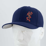 The Eternal Glyph Moab Shaman Petroglyph (Silicone) Flexfit® Premium Wool Blend Cap in navy features an orange petroglyph-inspired design, shown on a white geometric mannequin head against a light gray background.