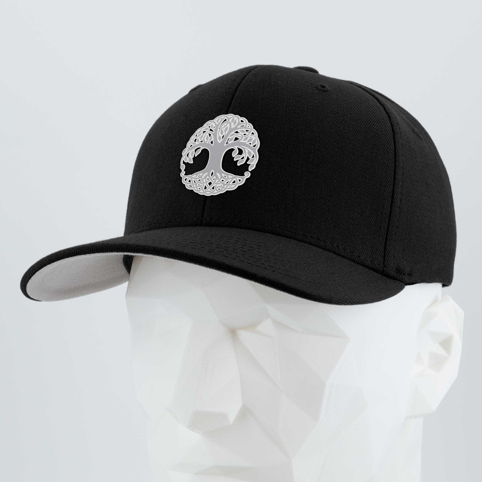 A Flexfit® Premium Wool Blend Cap by Eternal Glyph, featuring a metallic silver Yggdrasil (Tree of Life) embroidered on black, is displayed on a white mannequin head with a plain light background.