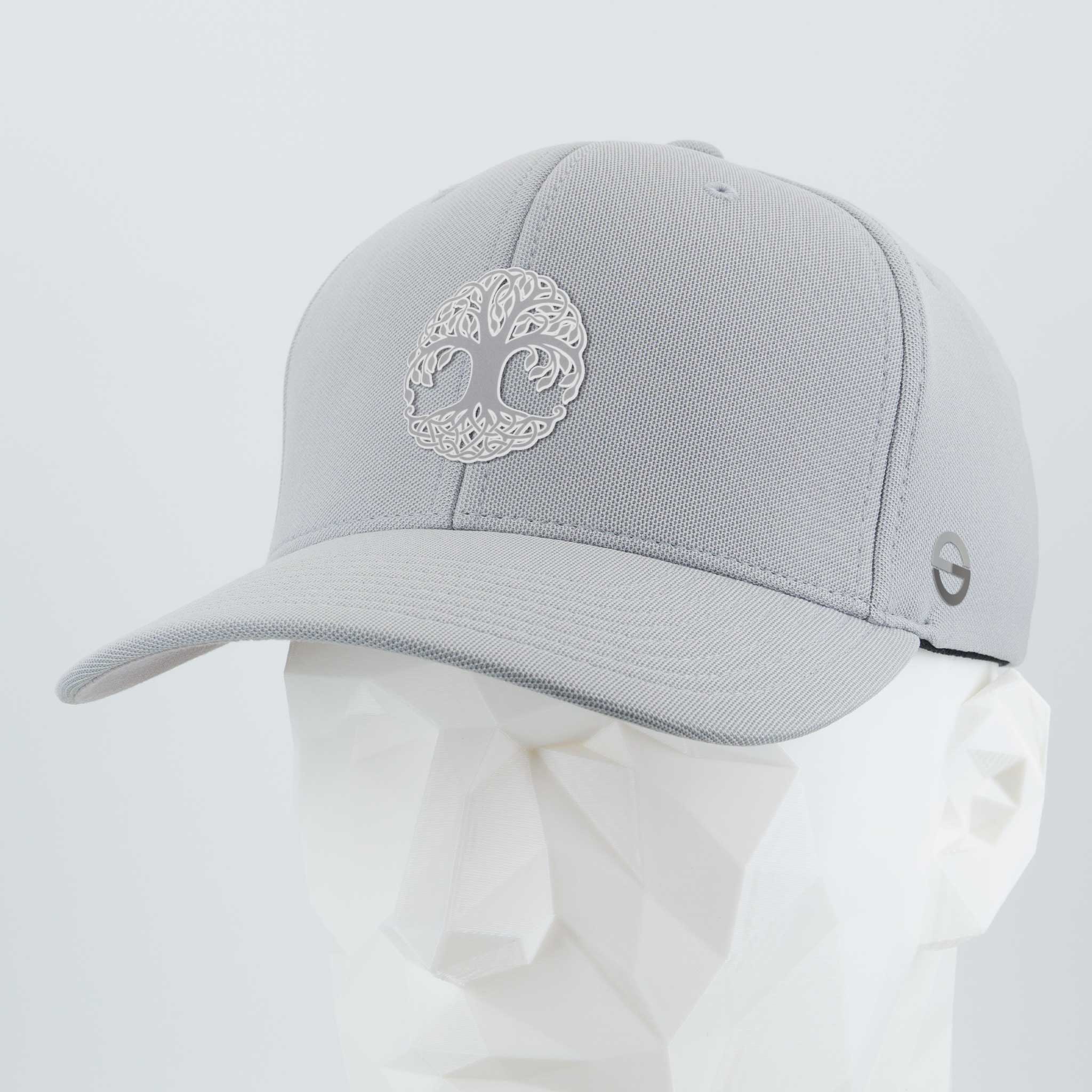 The Eternal Glyph Tree of Life, Yggdrasil, Metallic Silver (Silicone) Flexfit® Cool & Dry Cap features a metallic silver Yggdrasil on light gray fabric with a small gray logo on the side, shown on a faceted white mannequin head.
