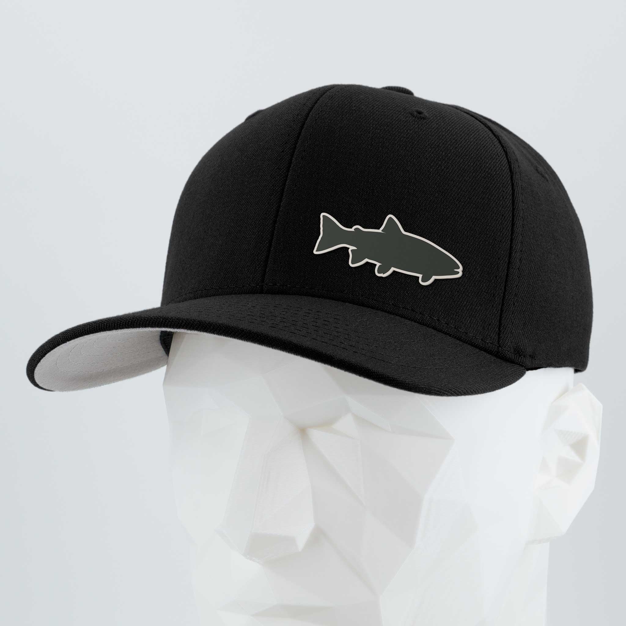 The Eternal Glyph Trout Fishing (Silicone) Flexfit® Premium Wool Blend Cap, in black with a stylized fish outline on the front, is shown on a white faceted mannequin head against a light gray background.
