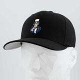 The Eternal Glyph Uncle Sam, I Want You (Silicone) Flexfit® Premium Wool Blend Cap in black features a bold embroidered patch of Uncle Sam and is showcased on a white geometric mannequin head against a light gray background.