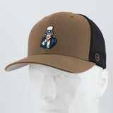 The Eternal Glyph Uncle Sam, I Want You! (Silicone) Flexfit® Mesh Trucker Cap in coyote/black features an embroidered Uncle Sam patch on the front panel, displayed here on a white mannequin head.