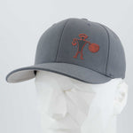 The Eternal Glyph Spiral Warrior Petroglyph (Silicone) Flexfit® Premium Wool Blend Cap in dark gray features a red-orange abstract design inspired by an ancient Moab, Utah carving. Shown on a faceted white mannequin head.