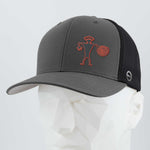 The Eternal Glyph Spiral Warrior Petroglyph (Silicone) Flexfit® Mesh Trucker Cap in dark gray and black features a red line design inspired by Moab, Utah's petroglyph, shown on a white geometric mannequin head.